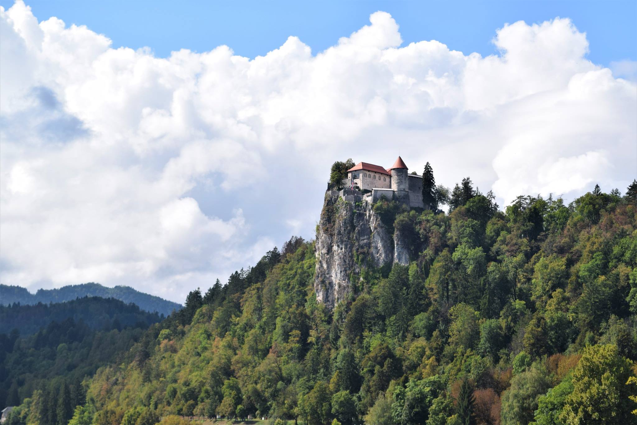Castle Bled reflected in still water — a moment of quiet between mountains.
